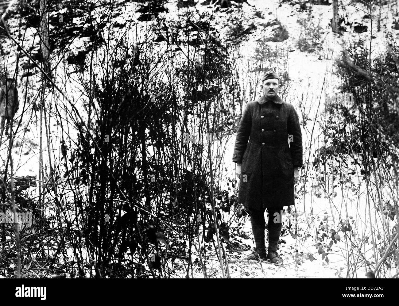 Sgt. Alvin C. York standing in front of hill where he, with the aid of 17 men, captured 132 German prisoners on Oct. 8, 1918. Stock Photo