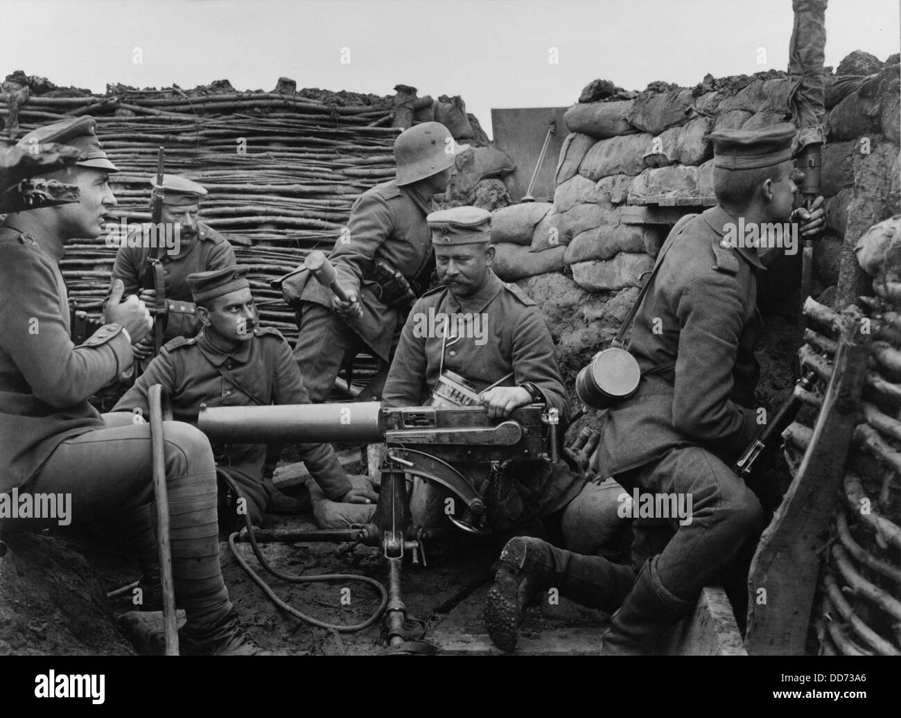German WW1 soldiers with machine gun 40 meters from the British trenches. 1916. A soldier with the metal helmet is ready to Stock Photo