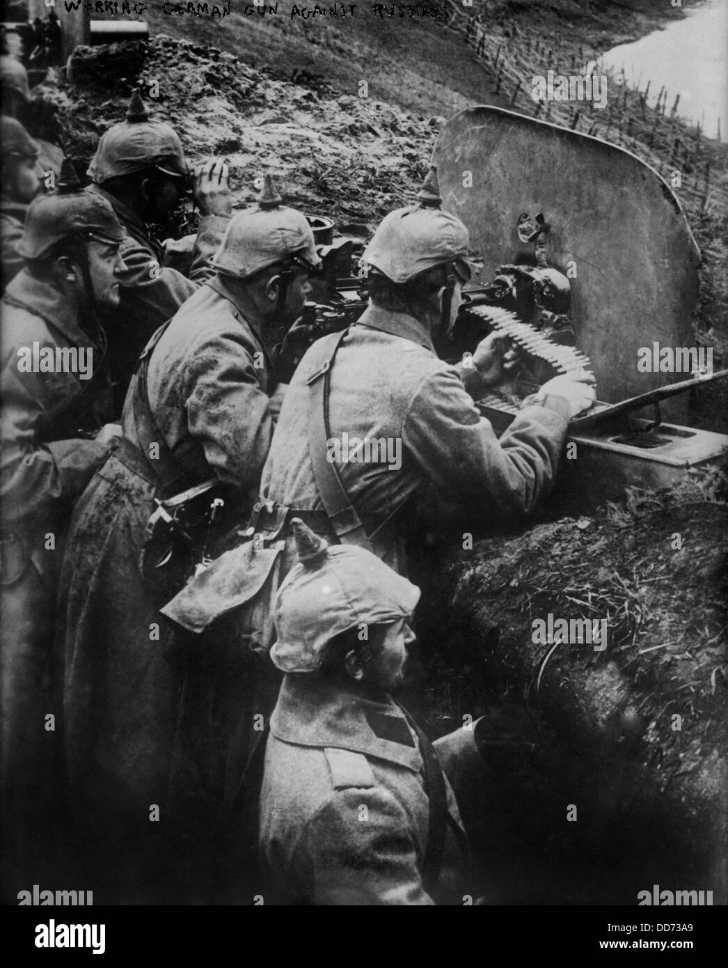 German WW1 machine gun crew firing from a trench on the Eastern Front. 1914-15. (BSLOC 2012 4 127) Stock Photo