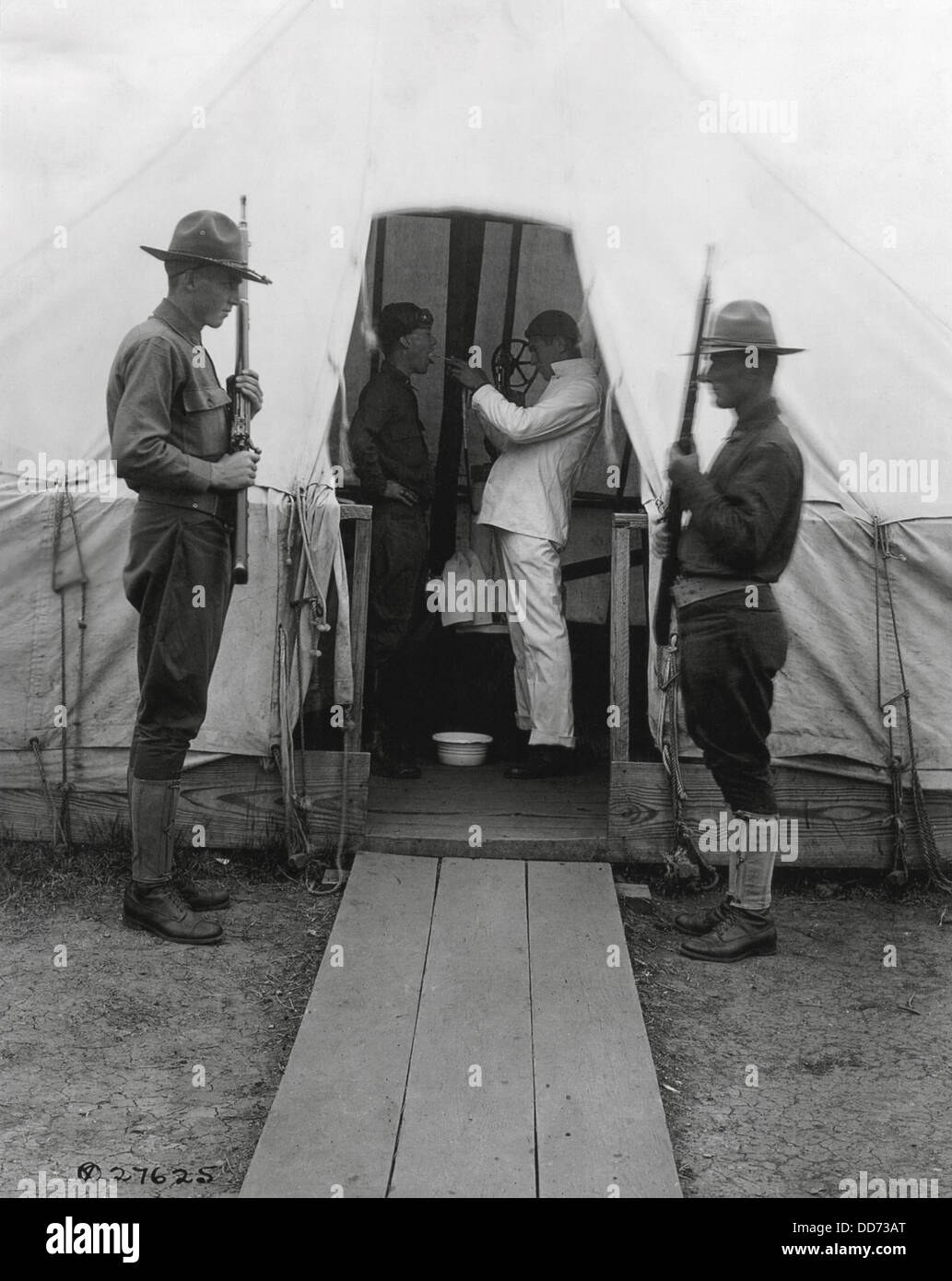 American soldier gets throat sprayed to prevent influenza. Dec. 1918. Medical tent at Love Field, Dallas, Texas, during the Stock Photo