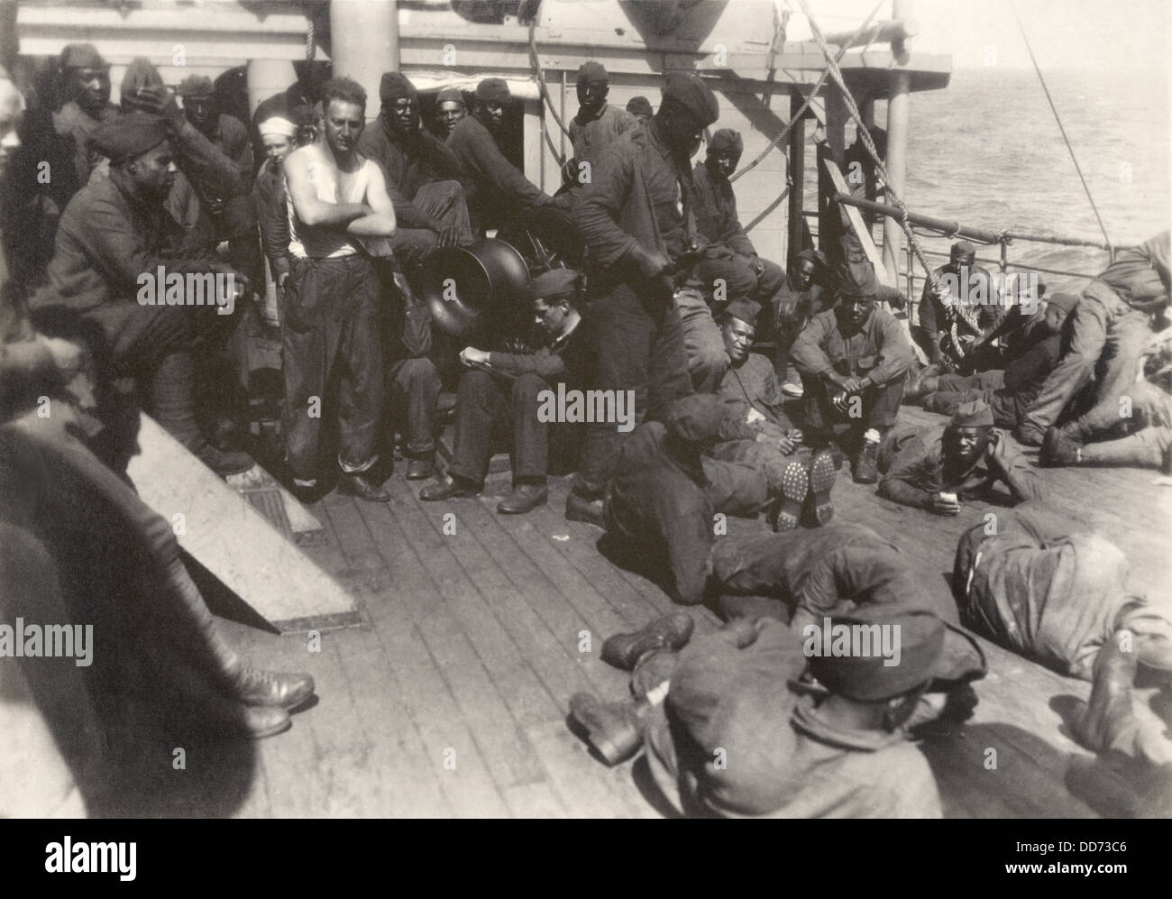 African American soldiers and white sailors on WW1 troop ship. July 18, 1919. The 803rd Pioneer Infantry Battalion gathered on Stock Photo