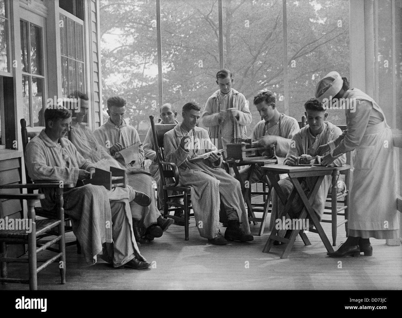 American World War 1 veterans in rehabilitation doing needlework. 1917-19. Boredom during long stays in military hospitals was Stock Photo