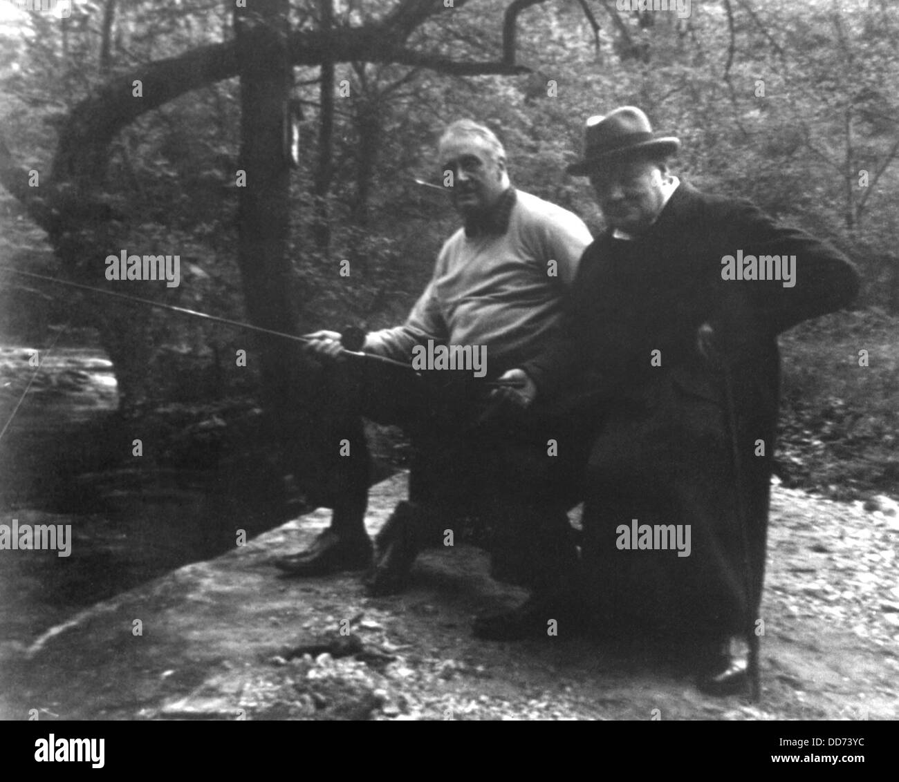 Franklin Roosevelt and Winston Churchill fishing at 'Shangri-La', Maryland. May 1943. The camp was built by the WPA from Stock Photo