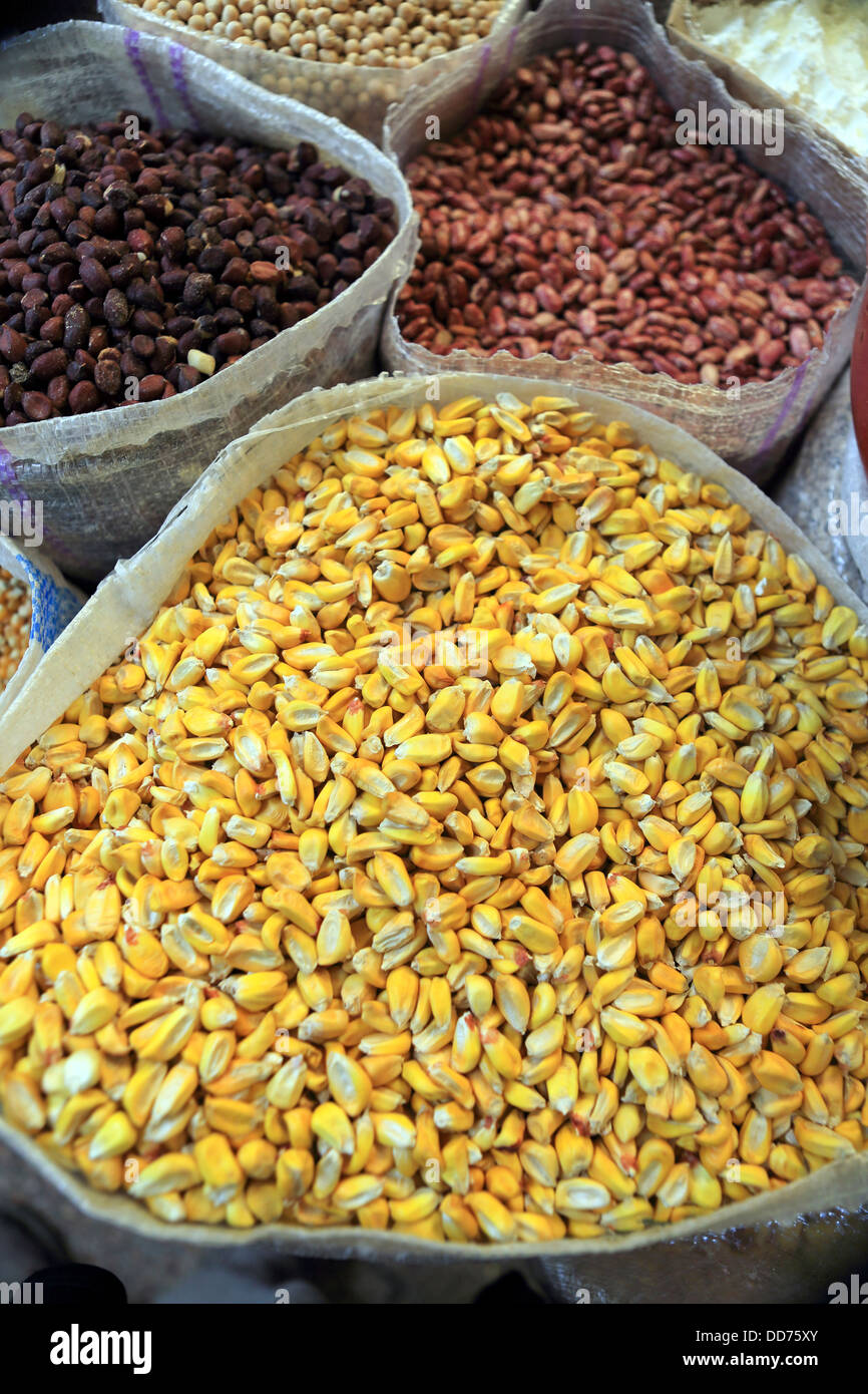 Corn, peanuts and other foodstuffs for sale at Otavalo market Stock Photo
