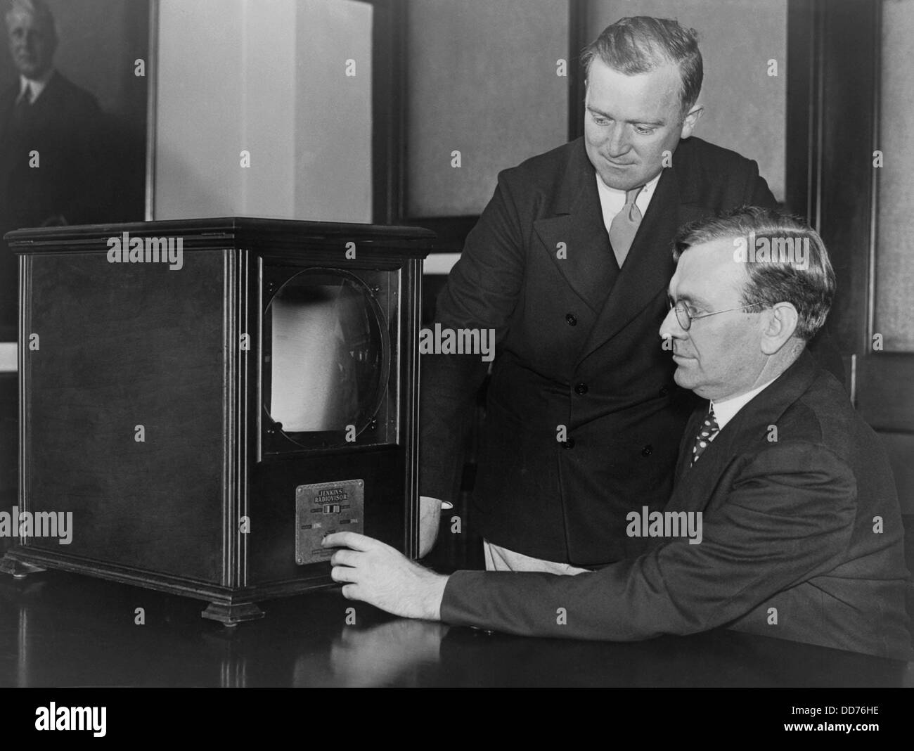Labor secretary William Doak and W.W. King, examining a 1931 television receiver at the Labor Department. The magnifying screen Stock Photo