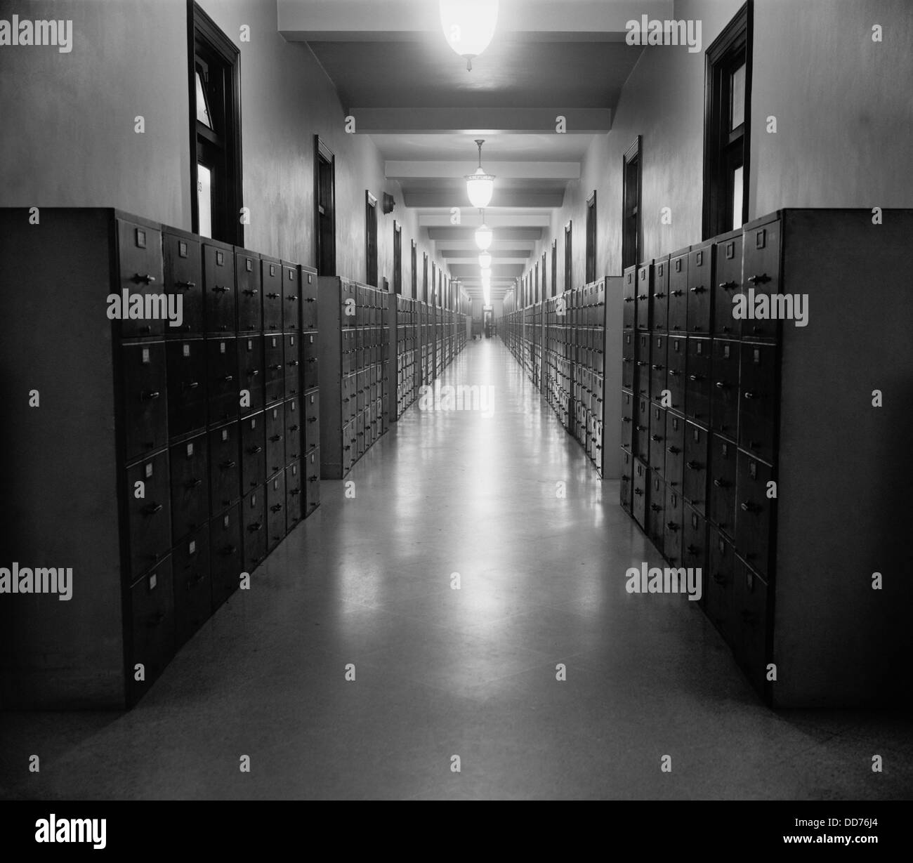 U.S. Government hallway lined with file cabinets, ca. 1937. (BSLOC 2013 8 179) Stock Photo