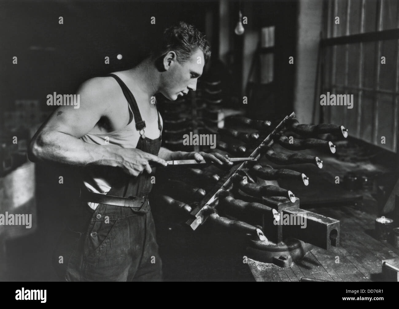 Worker building rubber dolls molds in Work Projects Administration (WPA) funded employment, Dec. 1936-July 1937. Photo by Lewis Stock Photo