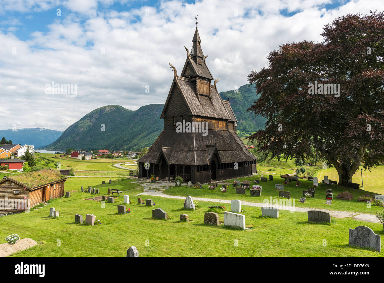 Norway, View of Hopperstad Stave Church and grave stones Stock Photo