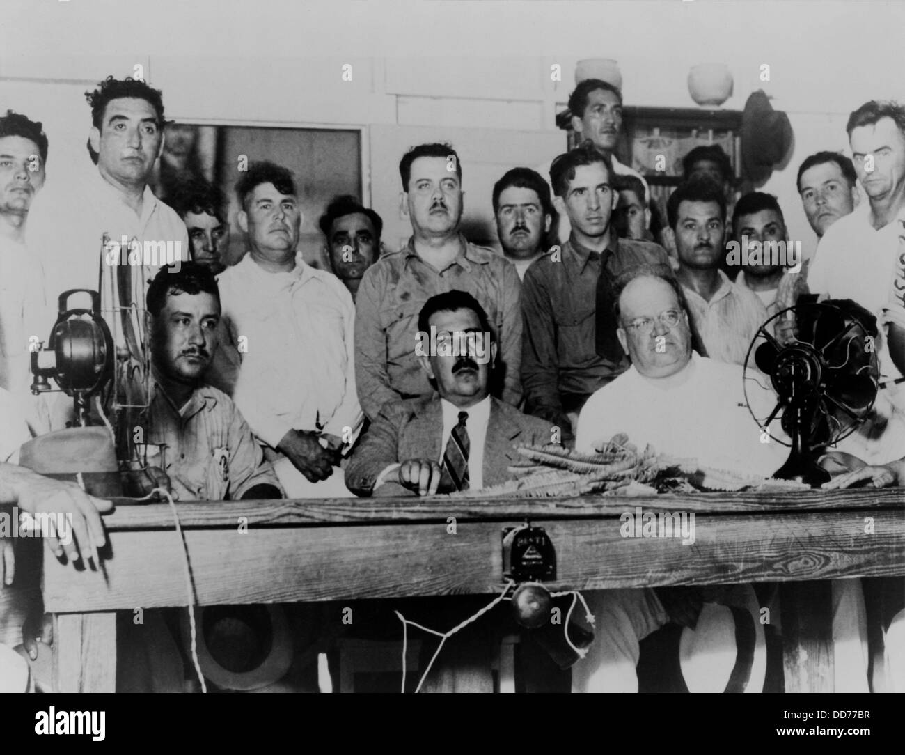 Mexican President Lazaro Cardenas meeting with oil labor leaders. On March 18, 1938, with the support of labor unions, Cardenas Stock Photo
