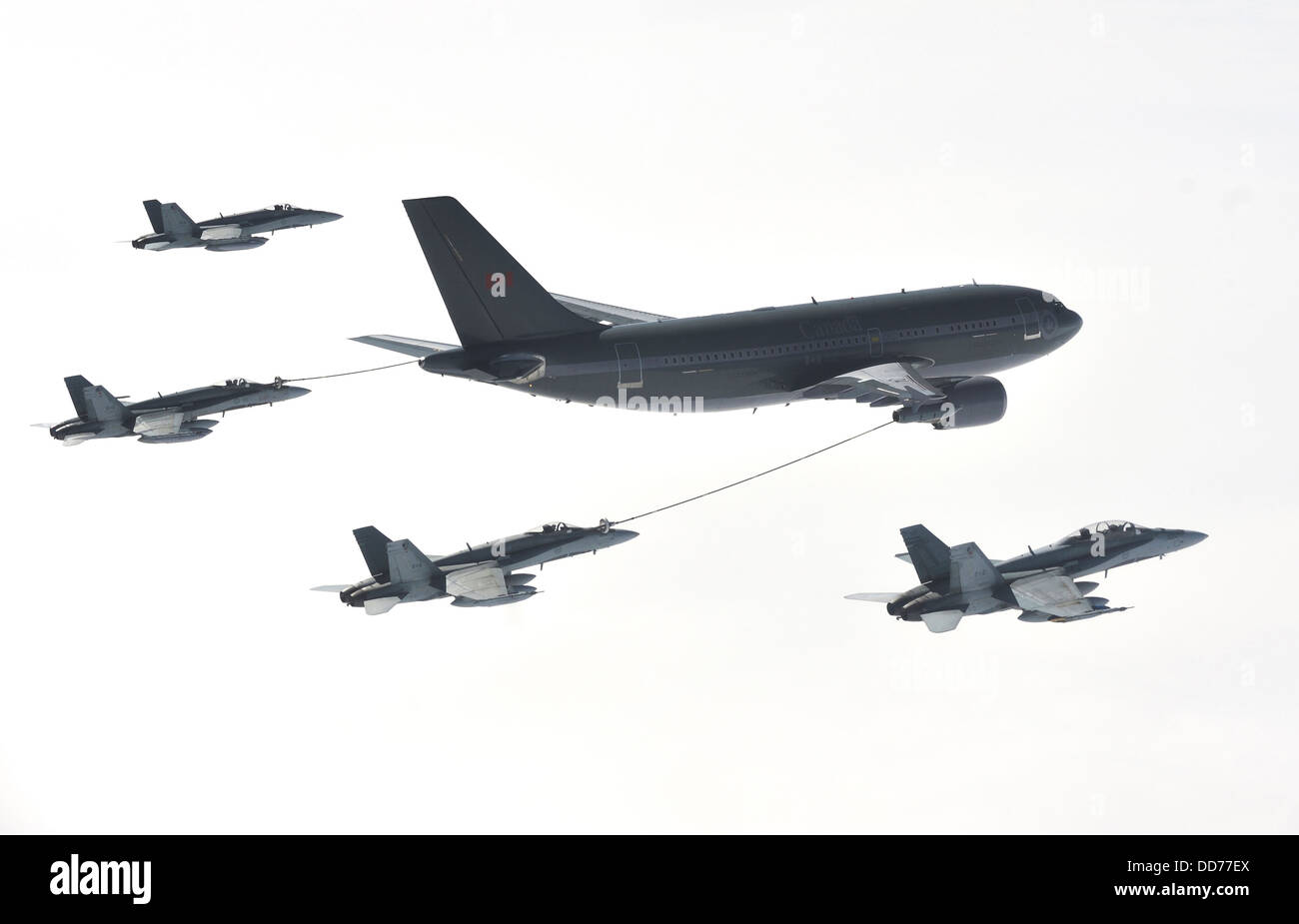 A Canadian Air Force CC-150 Polaris Airbus refueling aircraft from 437 Squadron Trenton provides air-to-air refueling to Canadian CF-18 Hornet fighter aircraft from 409 Squadron August 25, 2013 over Ottawa, Canada. Stock Photo