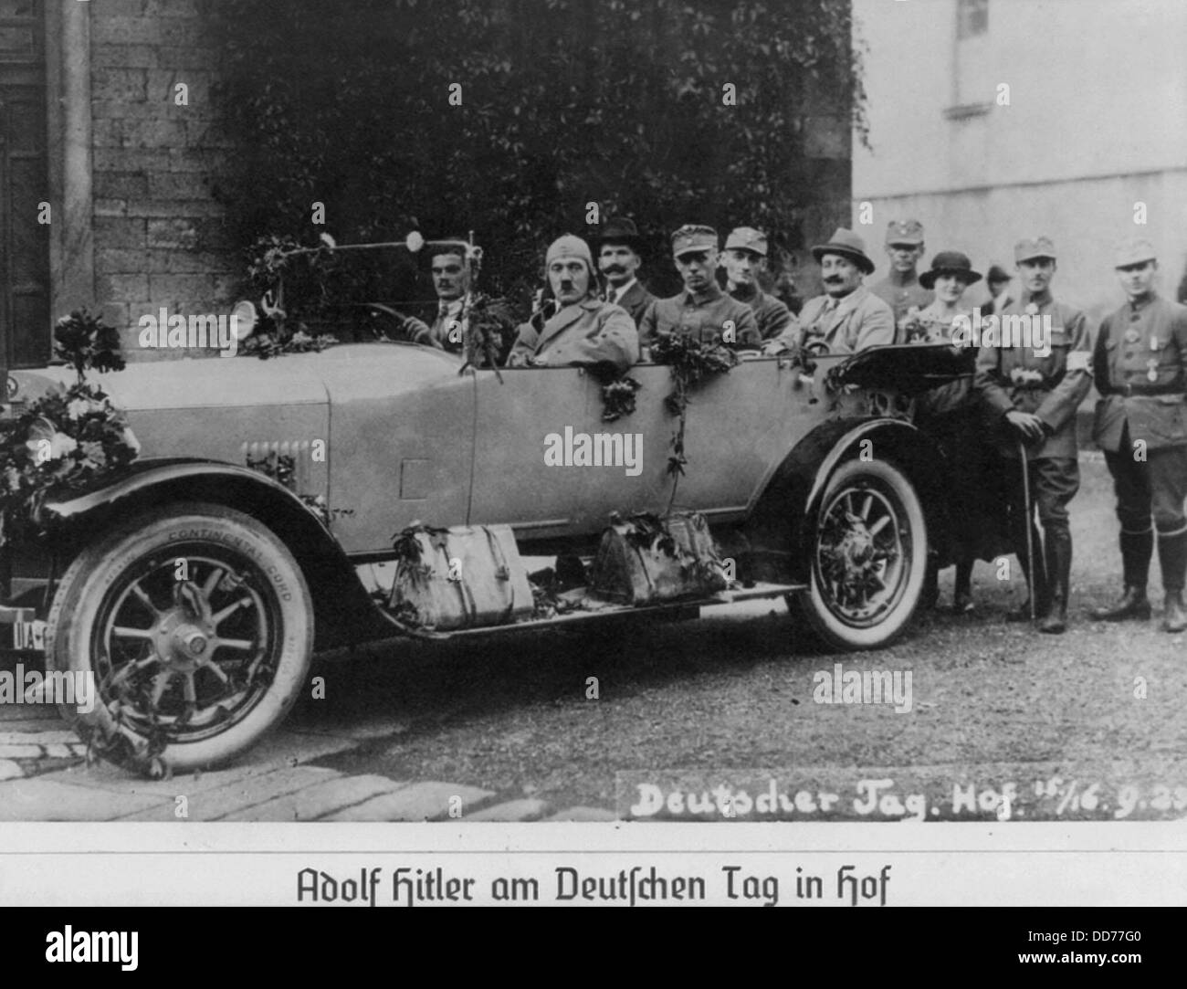 Nazis at German Day Rally held in Hof, Bavaria, Sept. 1923. Hitler wearing driving cap in open-air auto with Ulrich Graf; Stock Photo