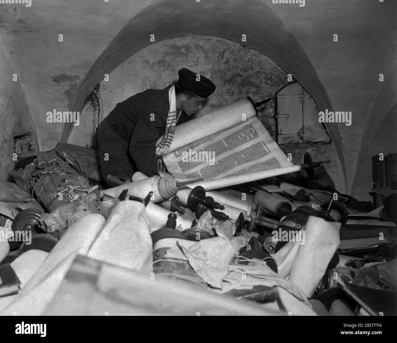 US Army Jewish Chaplain examines torahs stolen by Nazis. July 6, 1945. In the cellar of the Race Institute in Frankfurt, Stock Photo