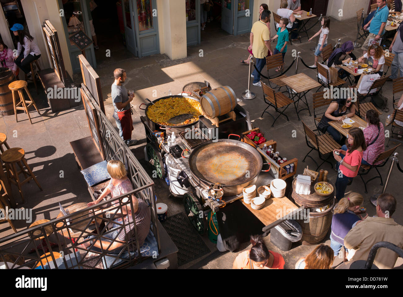 Looking down on an outside kitchen cooking paella. Outside Dining in Covent Garden. London Stock Photo