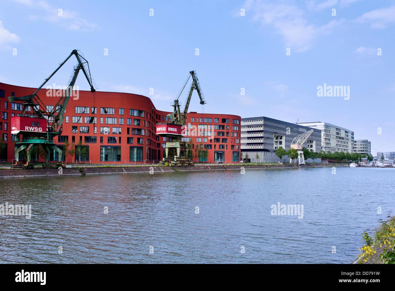 Germany, Norh Rhine Westphalia, Duisburg, Pier Eins with crane Stock Photo
