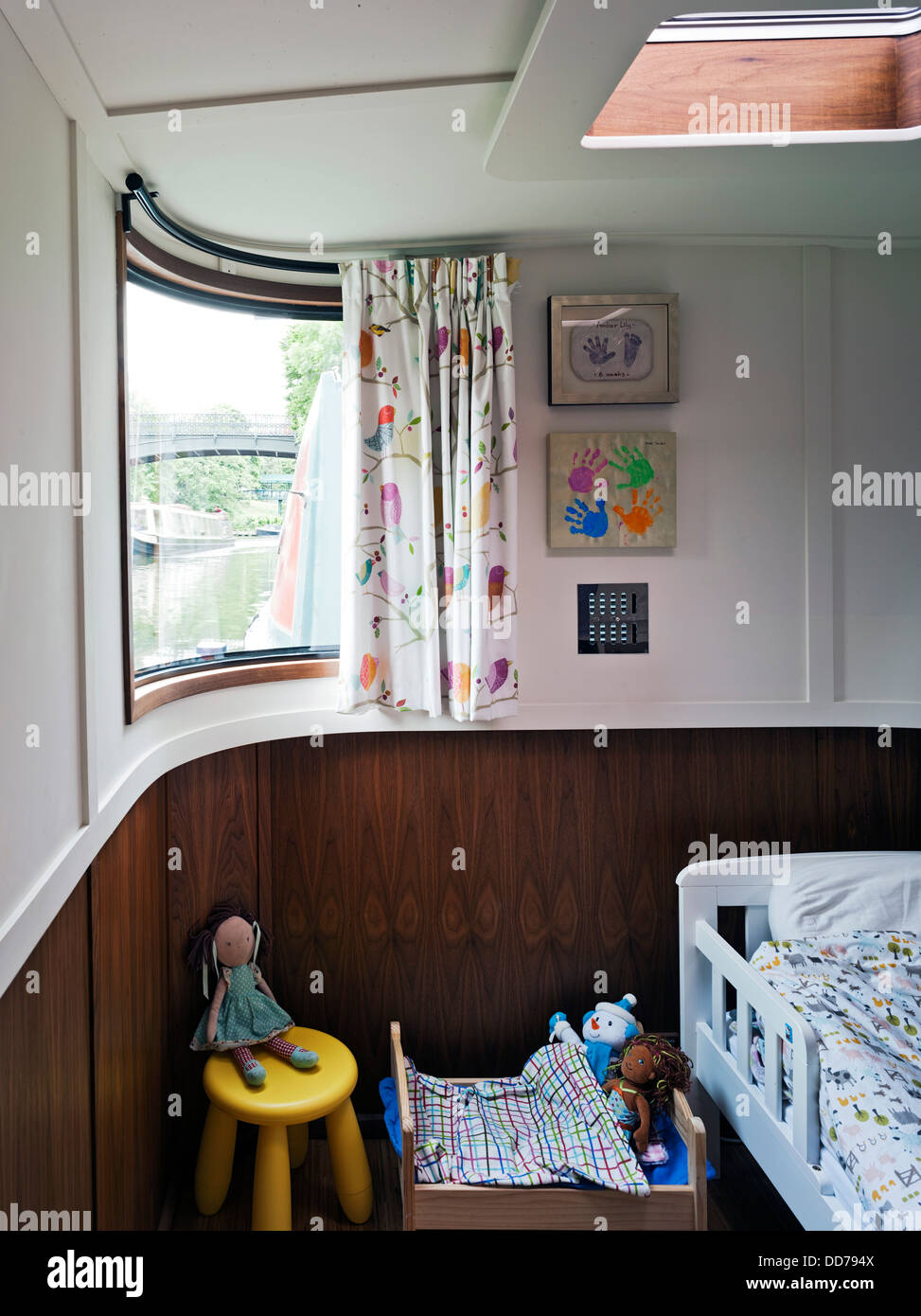 Narrowboat, London, United Kingdom. Architect: Pete Young, 2013. Daughter's bedroom with curved window. Stock Photo