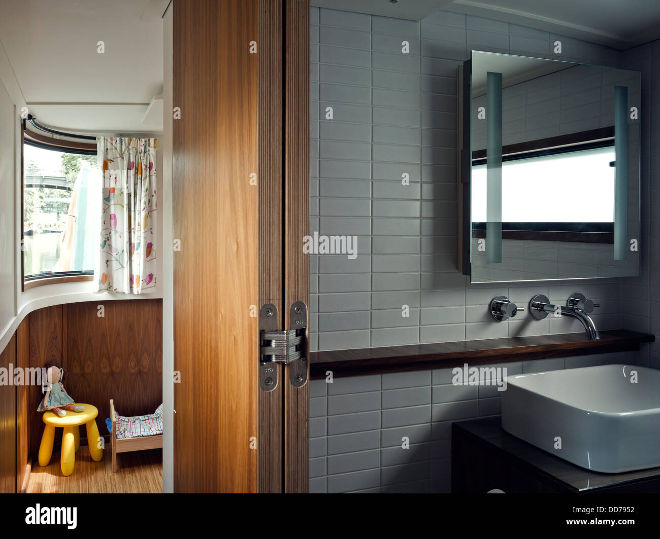 Narrowboat, London, United Kingdom. Architect: Pete Young, 2013. Bathroom basin and view to daughter's bedroom. Stock Photo