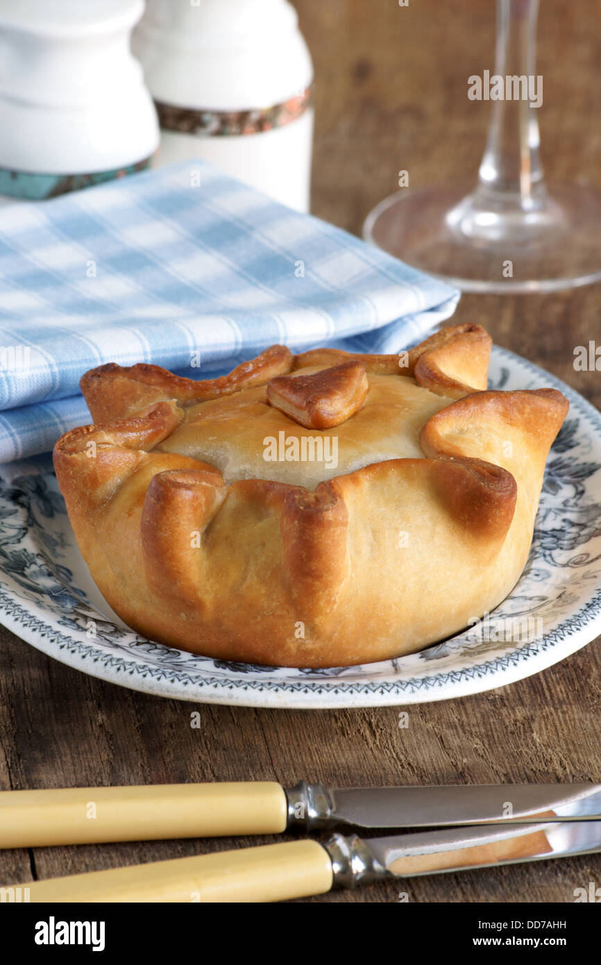 Traditional style British pork pie with handcrafted cold water pastry Stock Photo