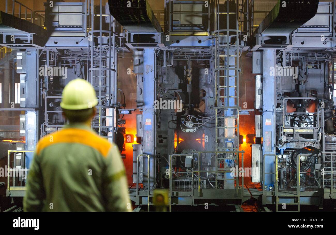 An employee of steel mill company Peiner Traeger is pictured at the