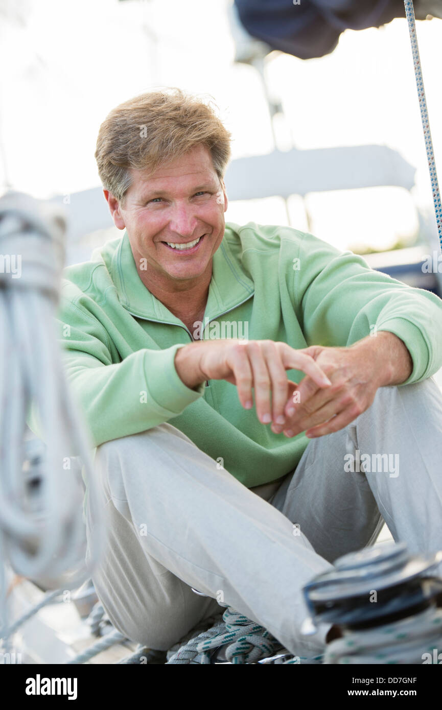 Man sitting on boat hi-res stock photography and images - Alamy