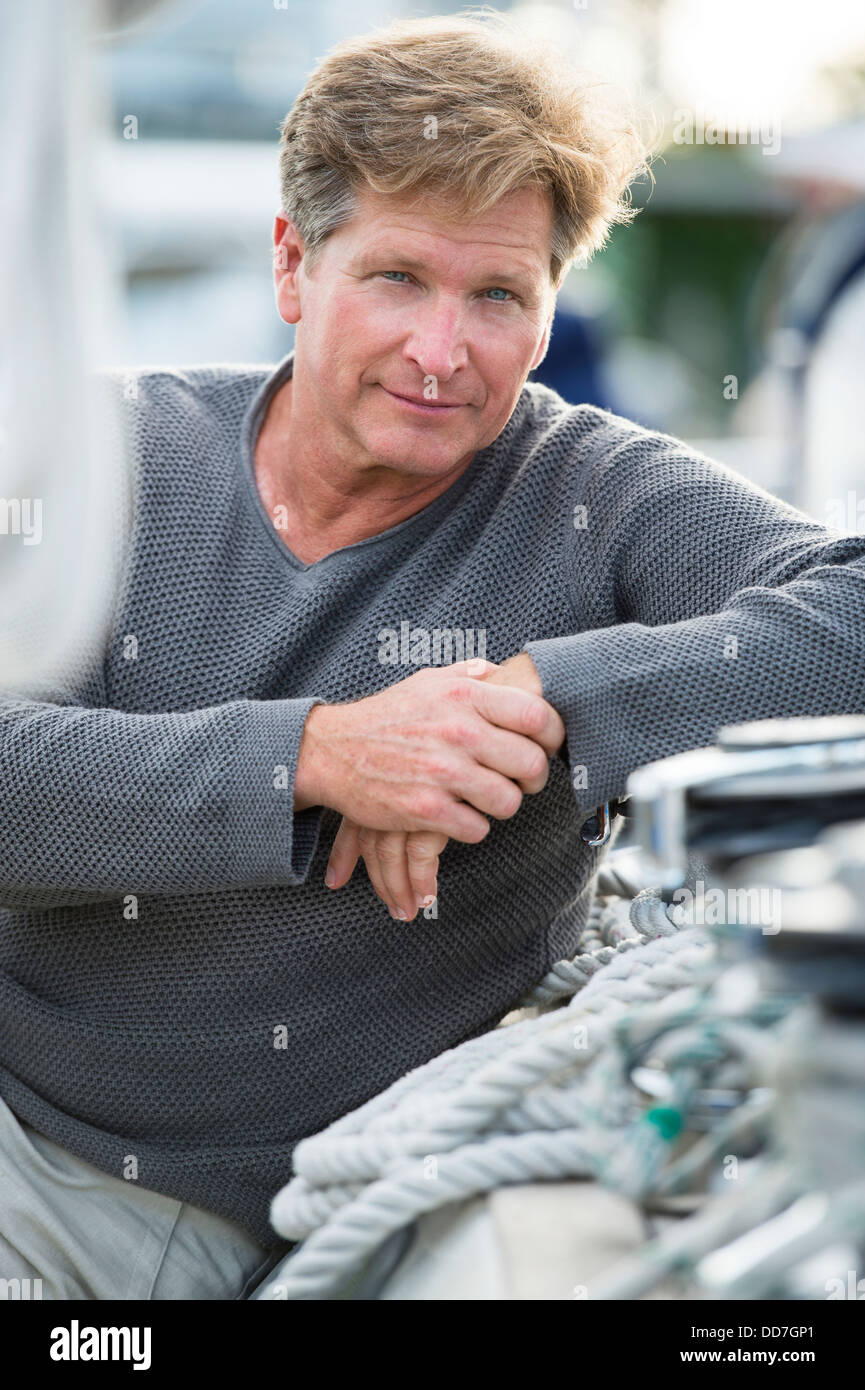 Man sitting on boat hi-res stock photography and images - Alamy