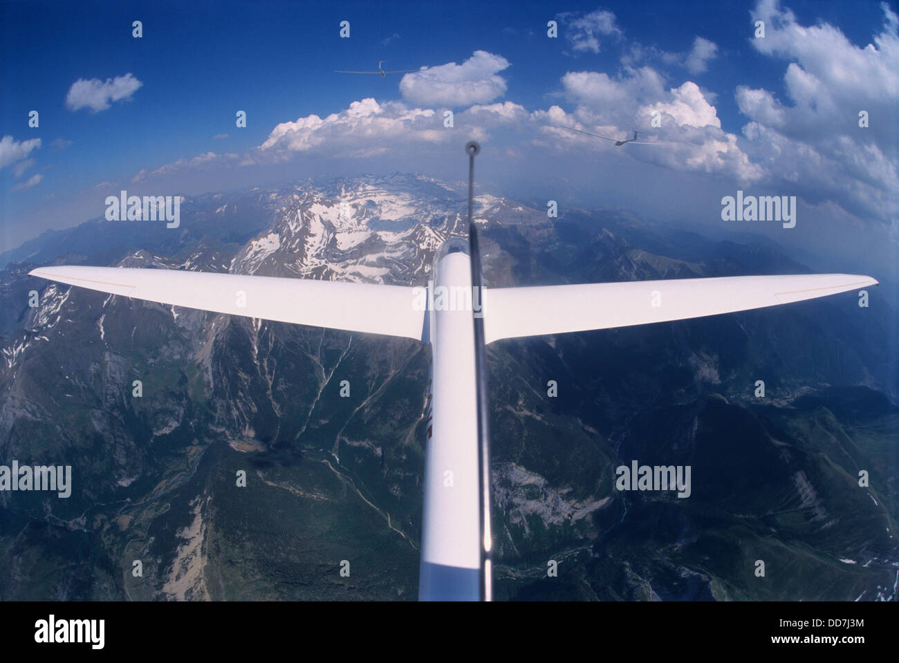 Glider plane Twin Astir flying with two other over Pena de Otal and Ordesa valley, Aragon, Spain Stock Photo