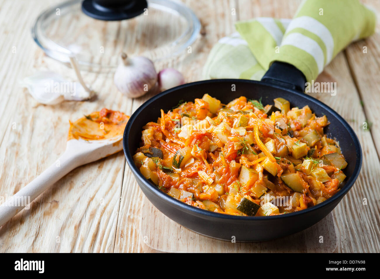vegetable stew with courgettes in a frying pan, close up Stock Photo