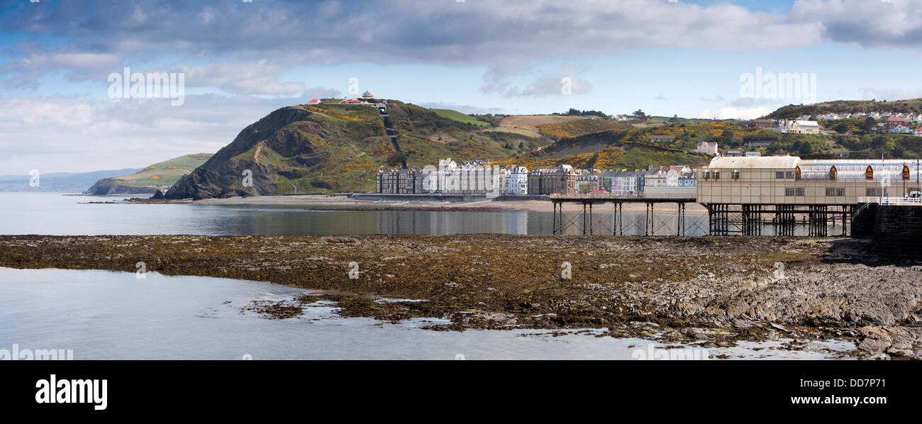UK, Wales, Ceredigion, Aberystwyth, seafront and pier at low tide, panoramic Stock Photo