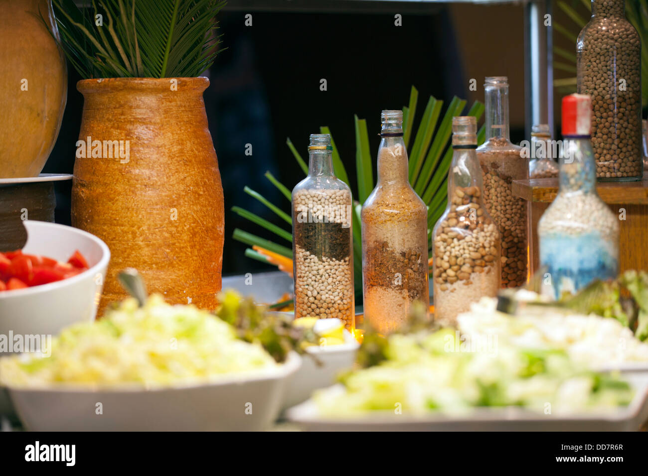 Shallow focus image of Egyptian salad and bottles of condaments Stock Photo