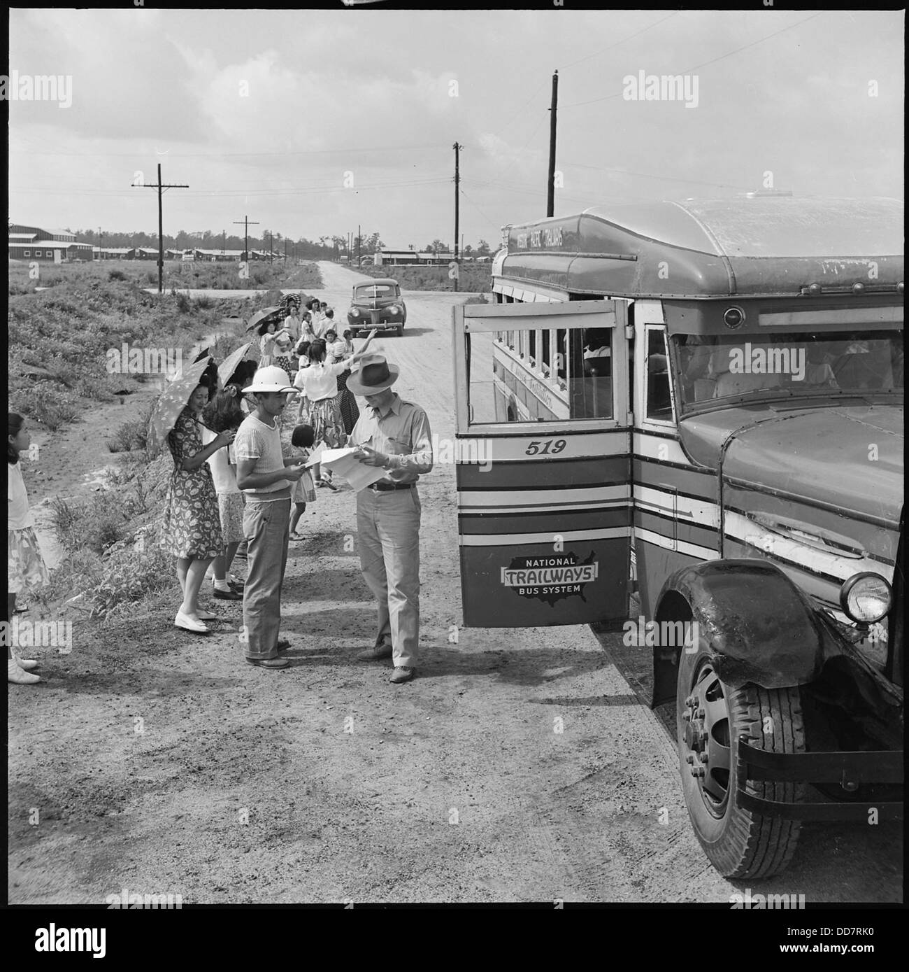 File Closing of the Jerome Relocation Center, Denson, Arkansas. Two War Relocation Authority transportat . . . - - 539812 Stock Photo