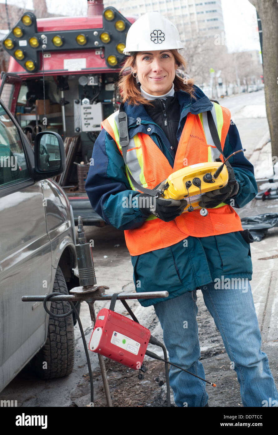 Portrait woman - city worker - None traditional profession - This lady is a specialist in detecting water leaks Stock Photo