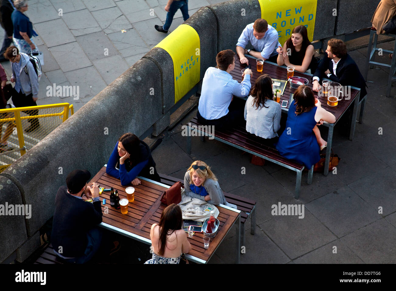 Londoners relaxing at an outdoor bar, The Southbank, London, England Stock Photo