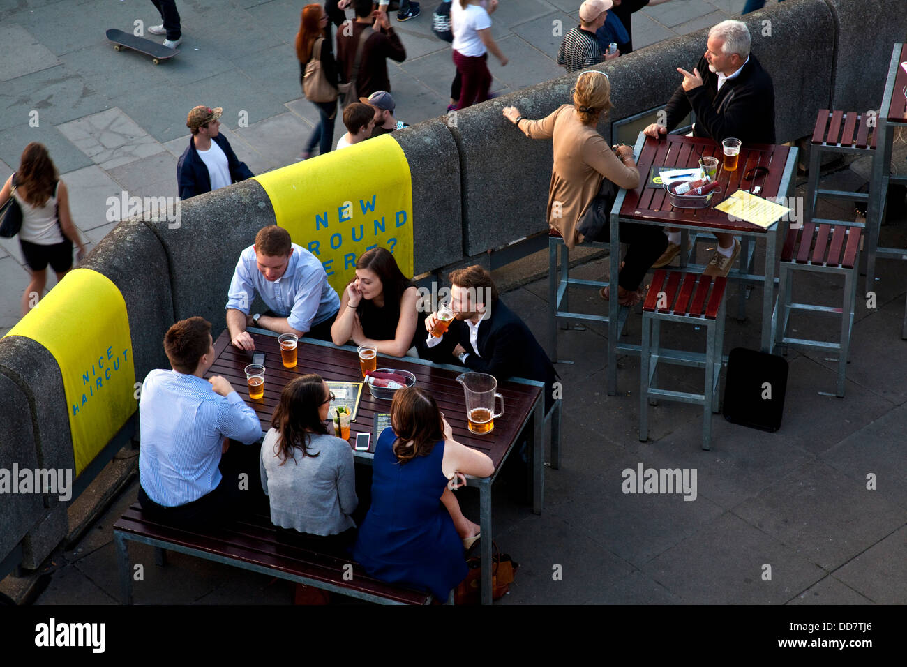 Londoners relaxing at an outdoor bar, The Southbank, London, England Stock Photo