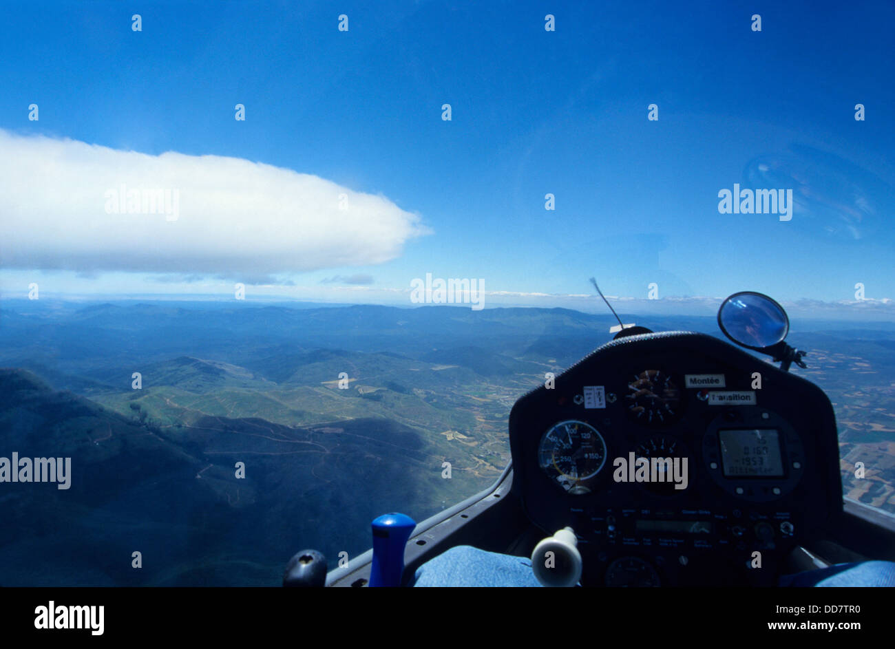 Inside view of glider plane flying in wave flight over Cuculo, Aragon