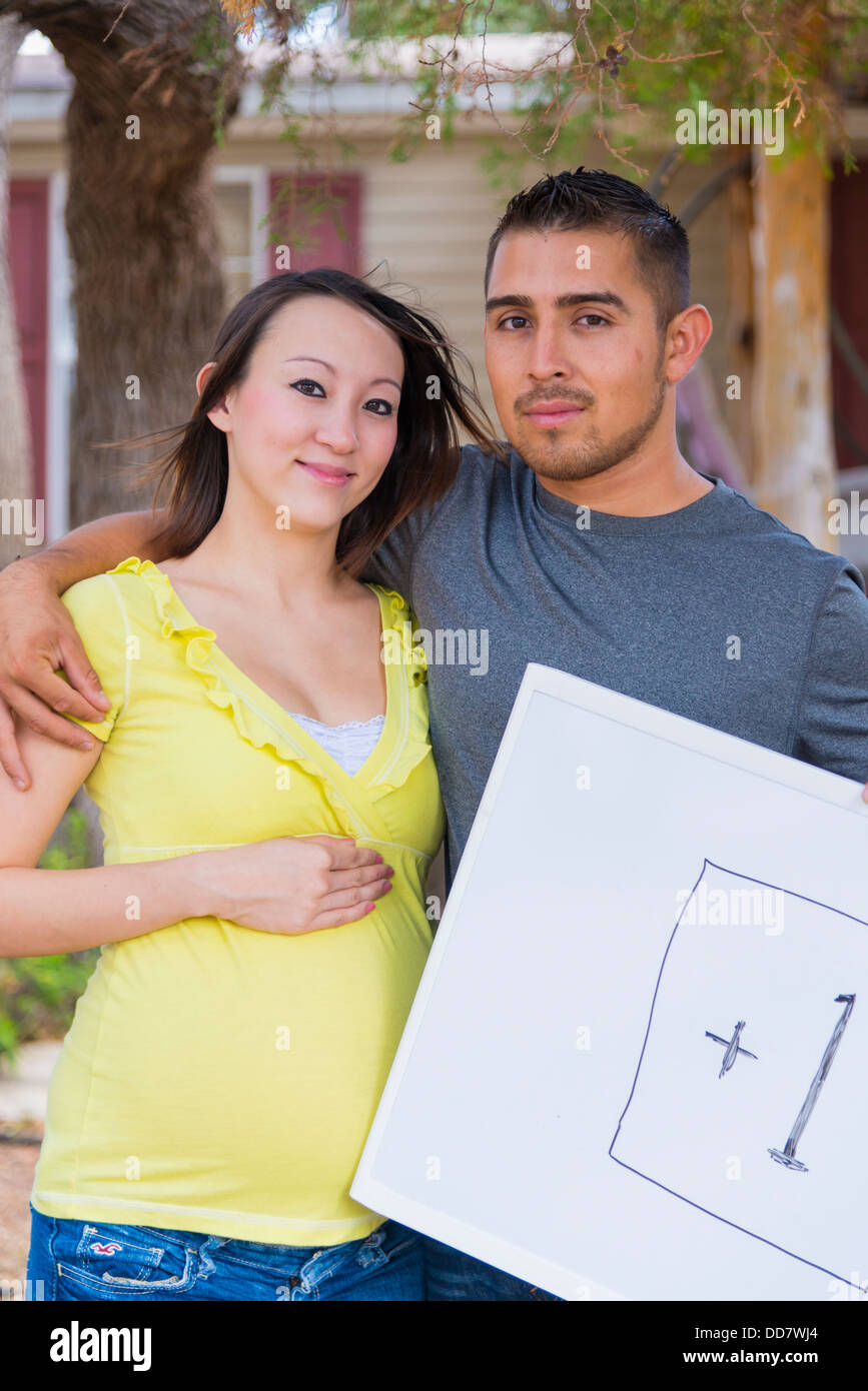 Expecting parent with +1 sign Stock Photo