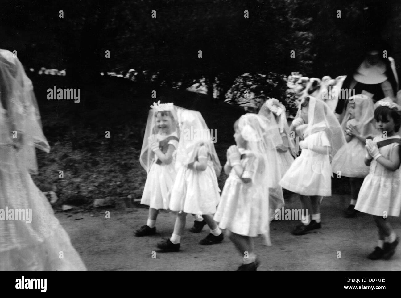 Young girls in a procession to their first Holy Communion, Oldham, Lancashire, UK Stock Photo