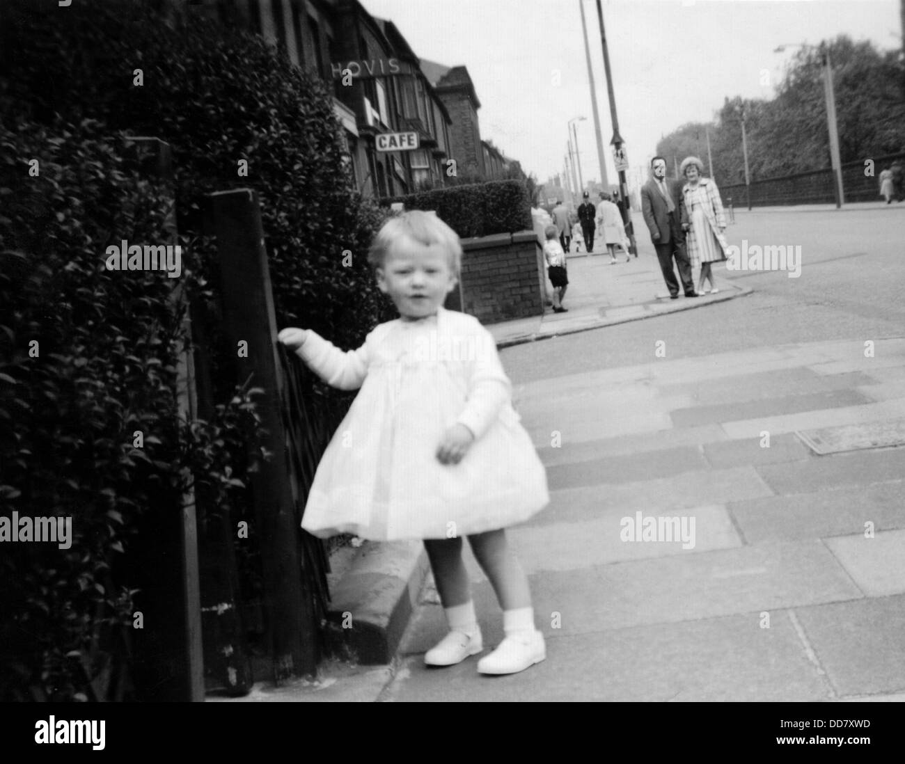 Young girl in white Whitsun dress, Oldham, Lancashire, UK Stock Photo