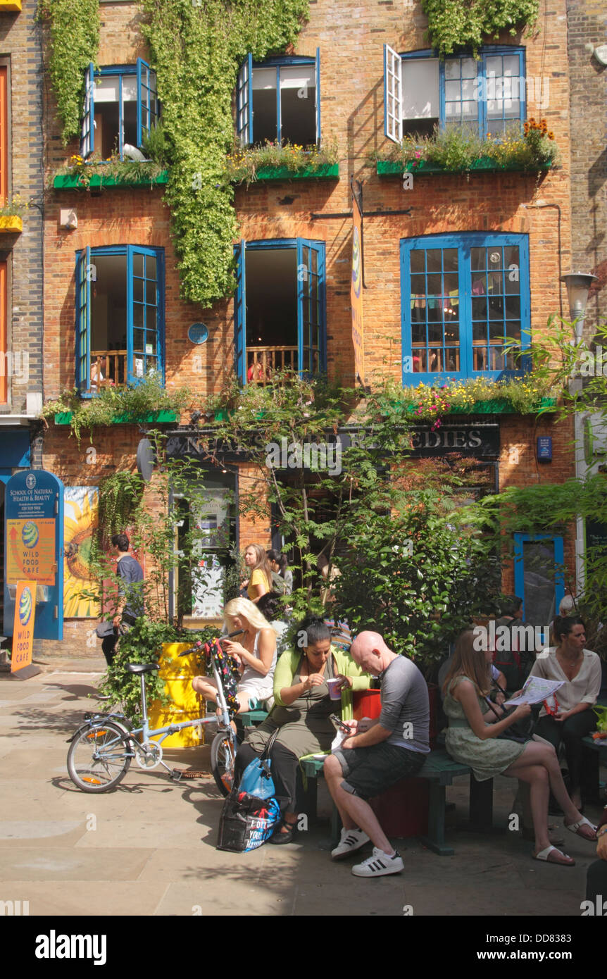 Neal's Yard Covent Garden London Wild Food cafe in background Stock Photo