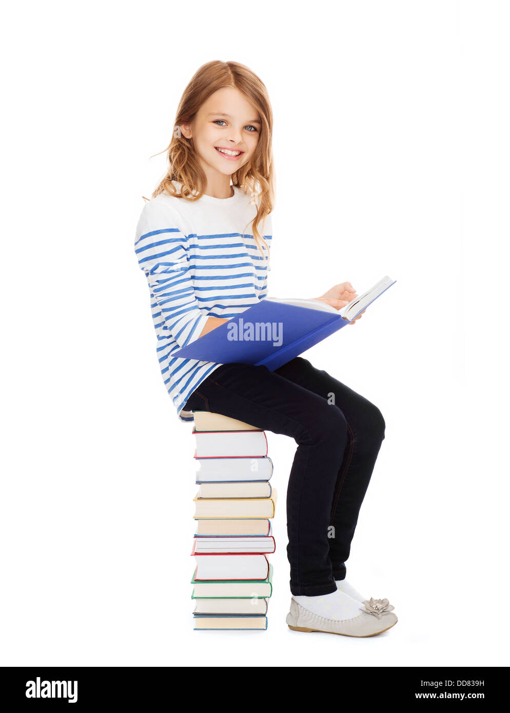 little student girl sitting on stack of books Stock Photo - Alamy