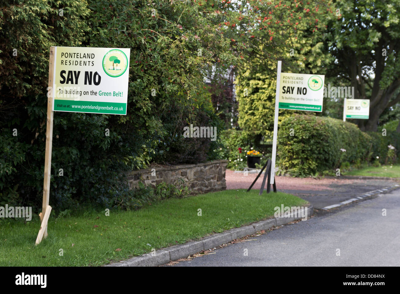 Signs protesting against building on green belt land. Stock Photo
