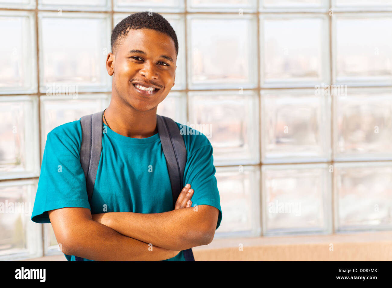 handsome African college student with arms crossed Stock Photo