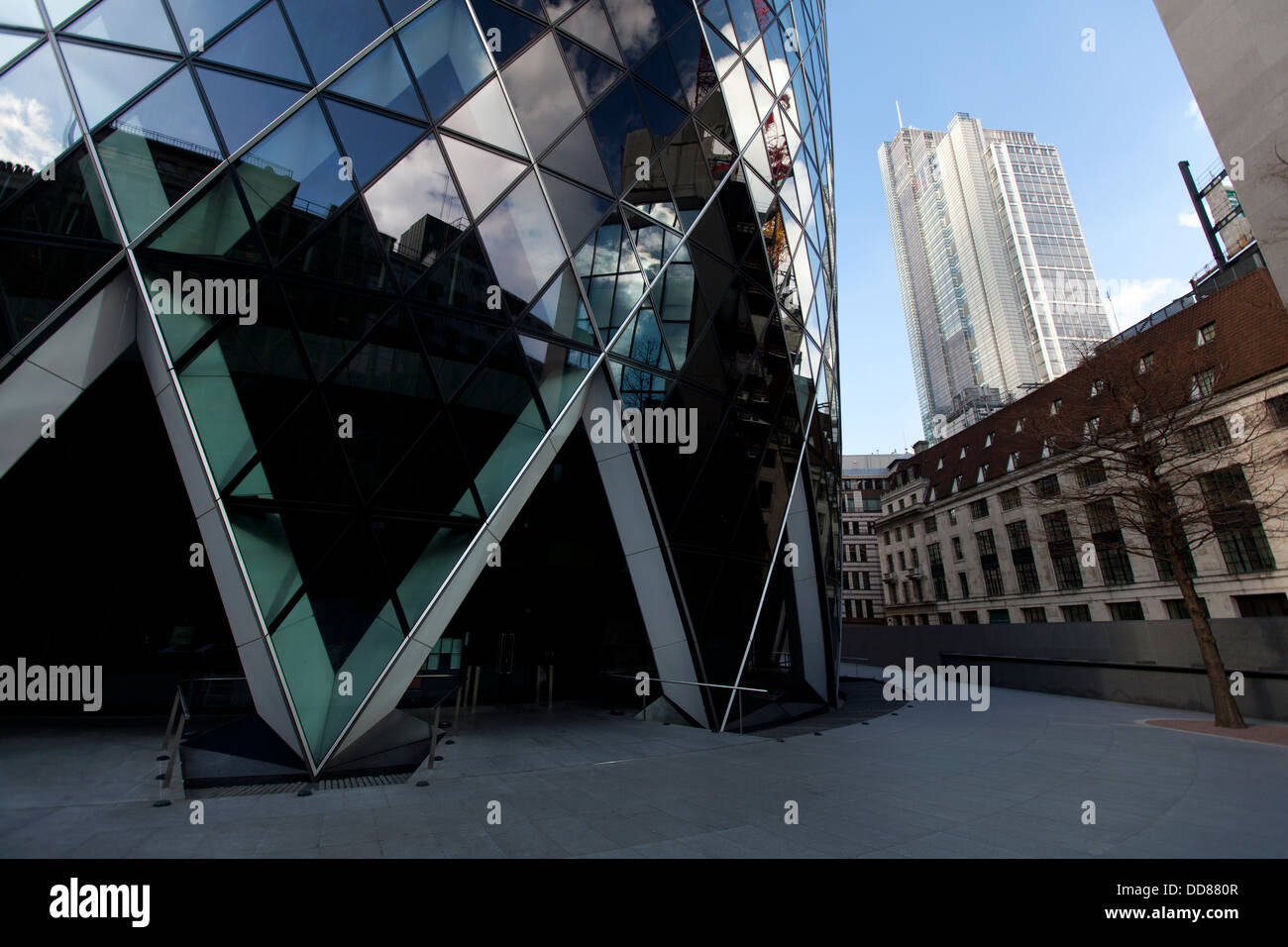 30 St Mary Axe, the Swiss Re Building (known as the Gherkin) with Heron Tower in the background, London, England, UK. Stock Photo