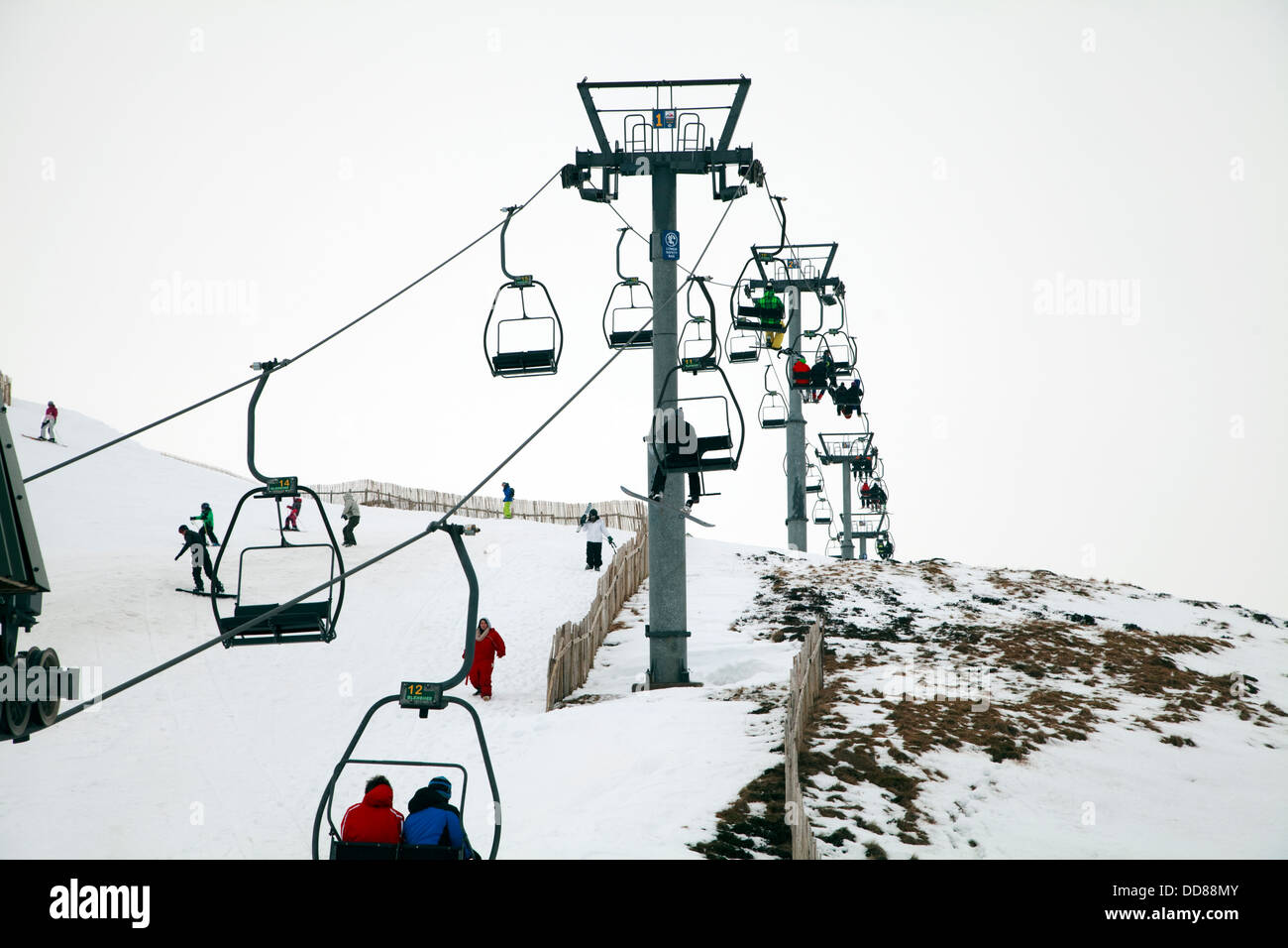 Glenshee, Scotland - February 3rd, 2013: People using the ski lifts and runs at the ski area in Glenshee, Scotland. Stock Photo