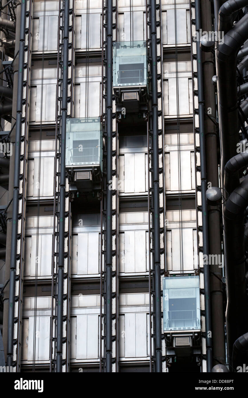 Elevators on the exterior of The Lloyd's building at 1 Lime Street, London, England, UK. Stock Photo