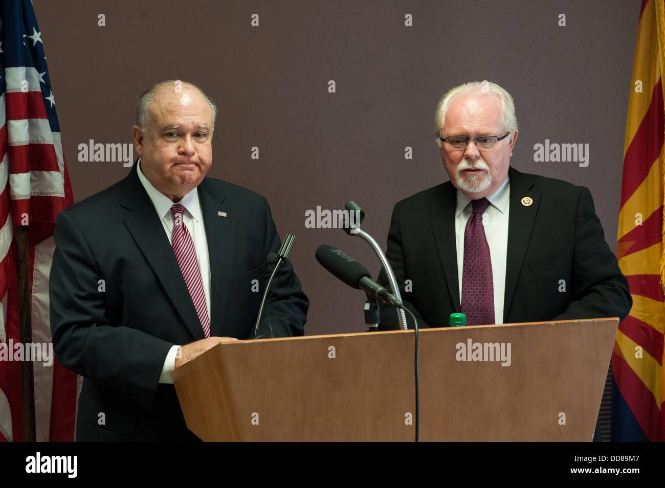 Tucson, Arizona, USA. 28th Aug, 2013. Under Secretary of the Army JOSEPH WESTPHAL, left, and Rep. RON BARBER (D-Ariz.), right, are in Barber's Southern Arizona district to tour military facilities and defense contractor plants. The men held a press conference at Tucson International Airport in Tucson, Ariz. after Westphal's arrival. Barber said he is leading Westphal's tour to make sure Westphal has an understanding of the importance of the military in Barber's district. Westphal said at this point there are no Administration plans for base realignment and closure programs becaus Stock Photo