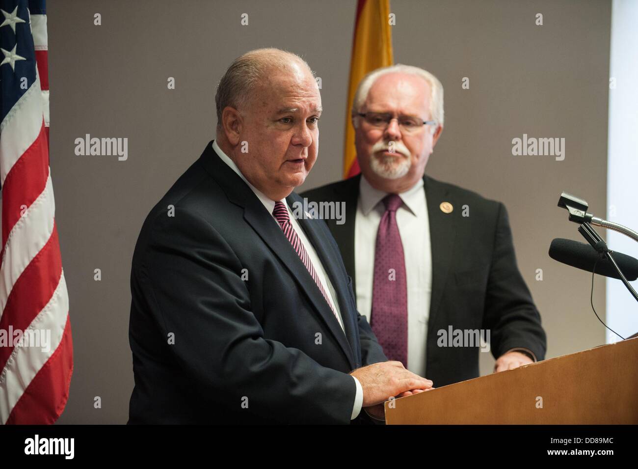 Tucson, Arizona, USA. 28th Aug, 2013. Under Secretary of the Army JOSEPH WESTPHAL, left, and Rep. RON BARBER (D-Ariz.), right, are in Barber's Southern Arizona district to tour military facilities and defense contractor plants. The men held a press conference at Tucson International Airport in Tucson, Ariz. after Westphal's arrival. Barber said he is leading Westphal's tour to make sure Westphal has an understanding of the importance of the military in Barber's district. Westphal said at this point there are no Administration plans for base realignment and closure programs becaus Stock Photo