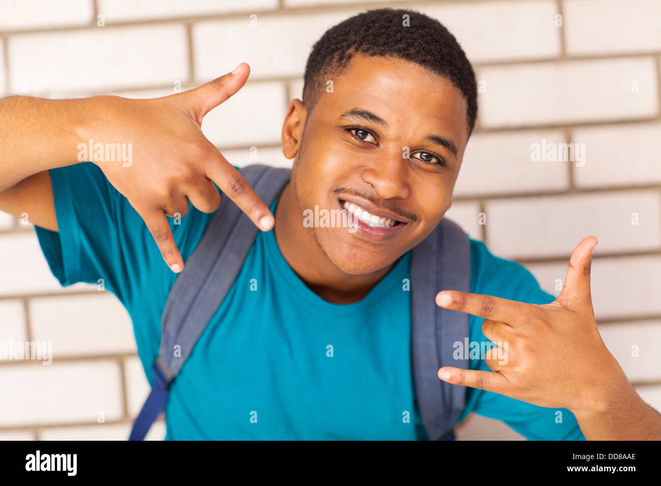 cheerful afro American college student with a cool hand sign Stock Photo