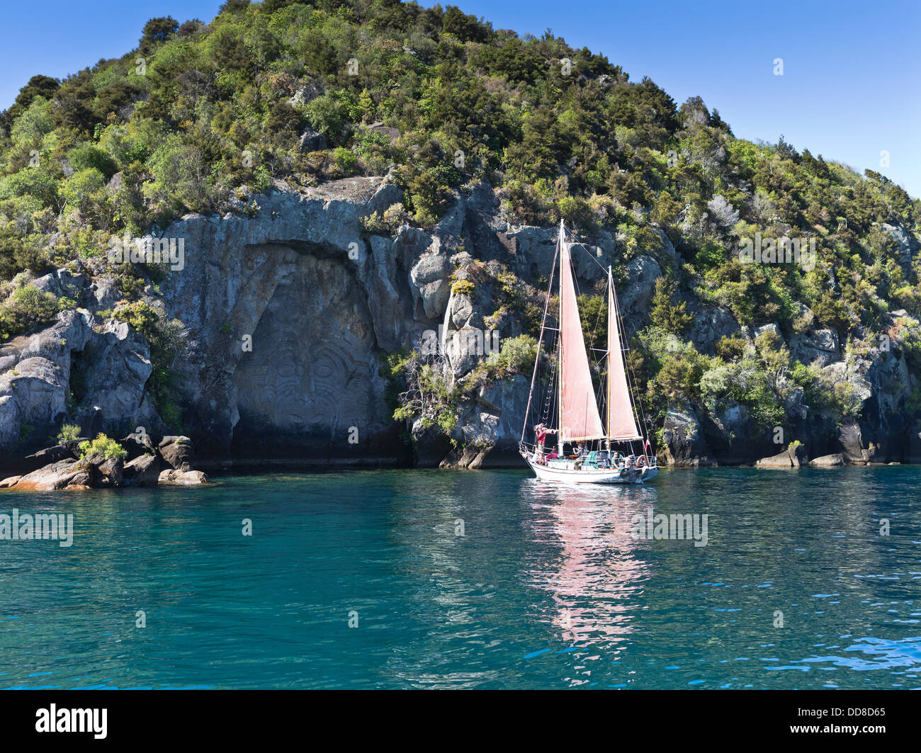 dh Maori rock carving LAKE TAUPO NEW ZEALAND Fearless sailing boat trip tourists tourism sight seeing tour Stock Photo
