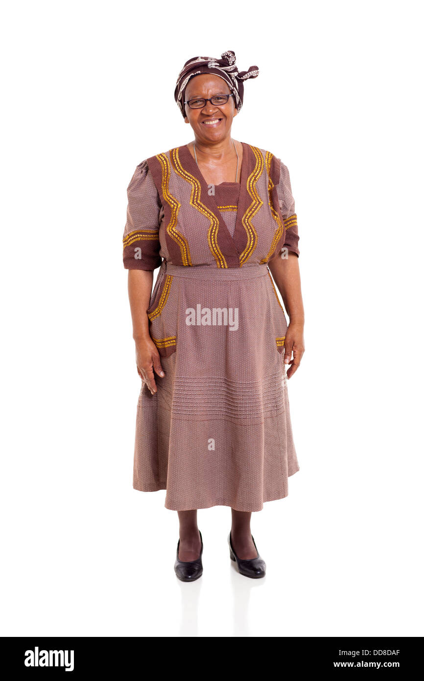 happy elderly African woman in traditional attire standing on white background Stock Photo