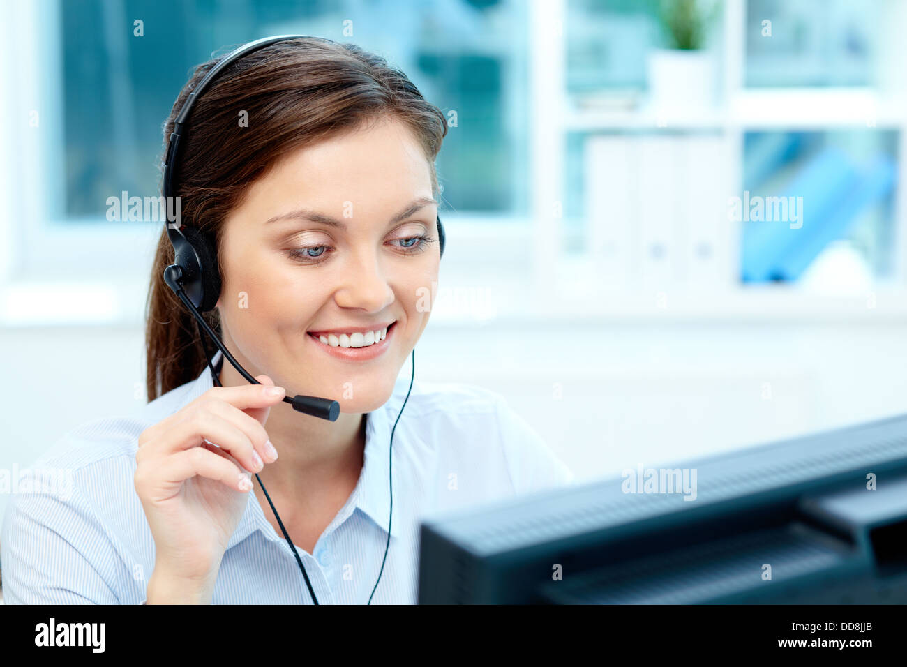 Close-up image of a cheerful representative wearing a headset Stock ...