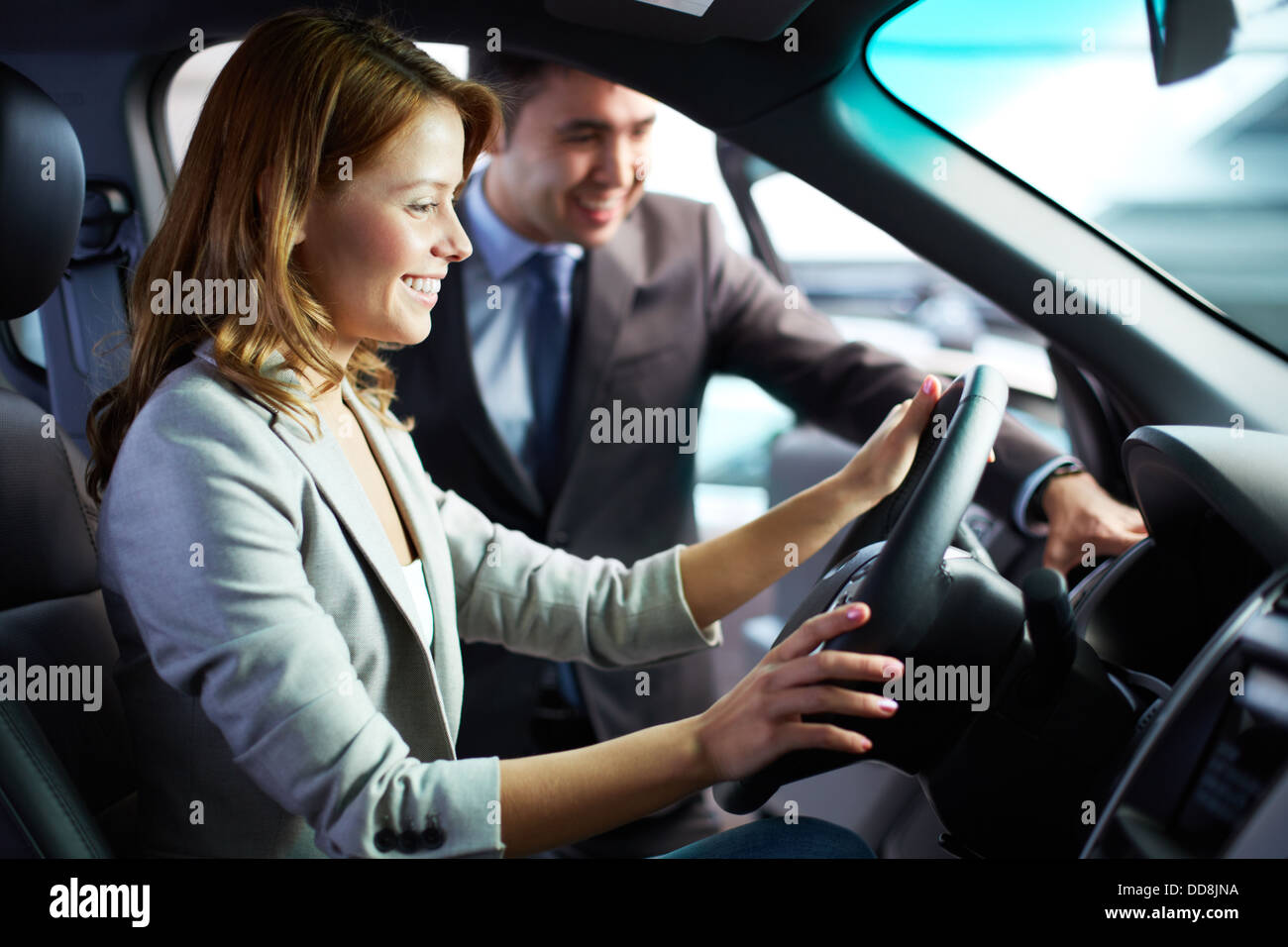Woman seated at steering wheel hi-res stock photography and images - Alamy